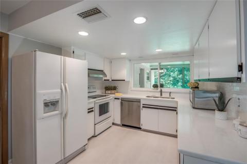 Newly remodeled kitchen with imported quartz counters.