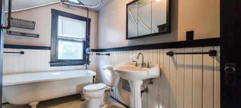 Gorgeous vintage bathroom with claw foot soaker..