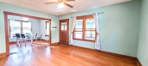 Bright & airy living space off front porch entry...