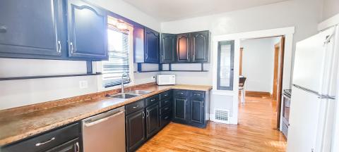 Kitchen with adorable glass spice cupboard & swing door...