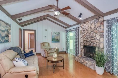 The soaring ceilings visually expands and raises the space, creates the effect of ???lightness???, accented by the wood beams.