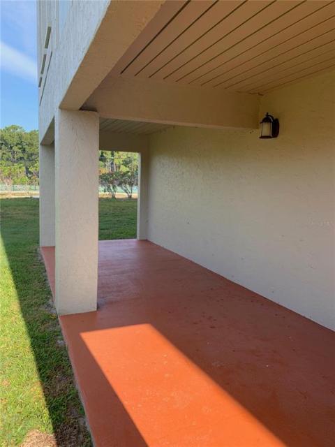 Third patio behind garage for joint use of units 108 and 208. Next to tennis courts of Bradenton Tennis Center.