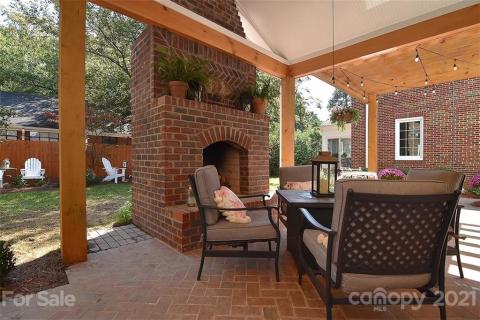 Outdoor living area with wood burning fireplace Outdoor living area with wood burning fireplace