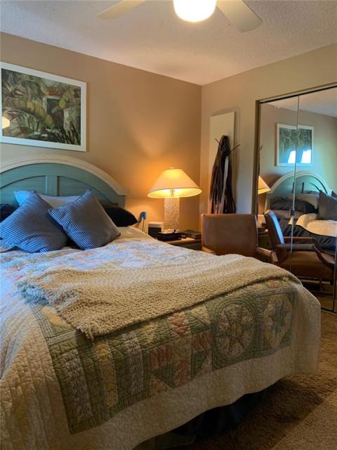 Front bedroom showing mirrored closet doors.