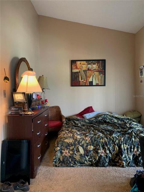 Front cathedral bedroom with private bath - with sliding doors to lanai. Can be set up as den instead for part-time visitors.