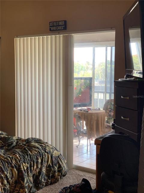Cathedral bedroom, with slider to lanai.