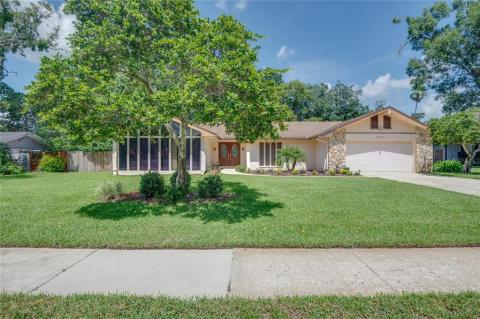 Nicely landscaped front yard! Oversized garage with shelving.