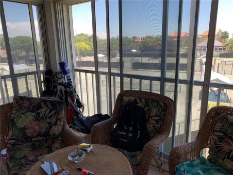 Lanai with slider doors which can be opened or closed and let air conditioning in this area.