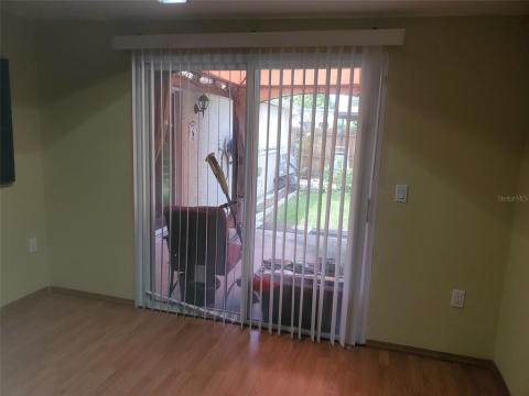 Office or 3rd bedroom with sliding glass doors leading to patio