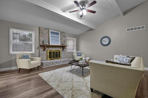 Vaulted great room with fireplace & Luxury Vinyl Flooring