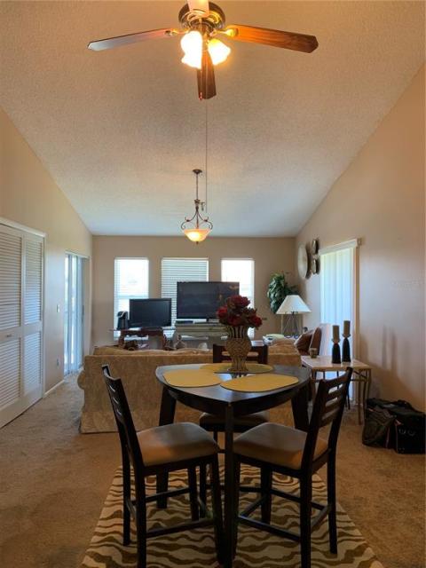 Dining area with cathedral ceiling.