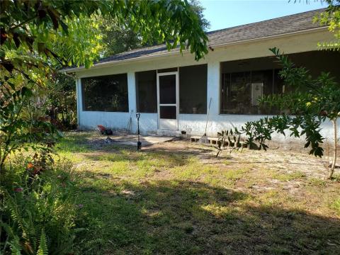 Back of the home showing the large screened porch