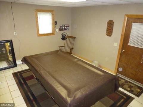 Lower level dining room currently houses a pool table