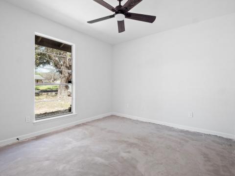 Spare room featuring a wealth of natural light, b