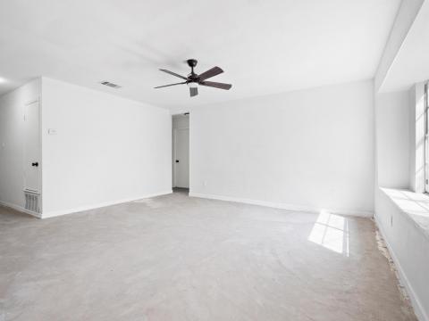 Unfurnished room with visible vents, baseboards, 