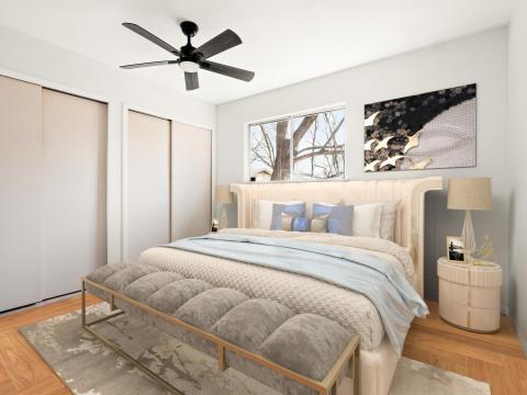 Bedroom featuring two closets, a ceiling fan, and