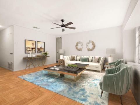 Living room with visible vents and a ceiling fan