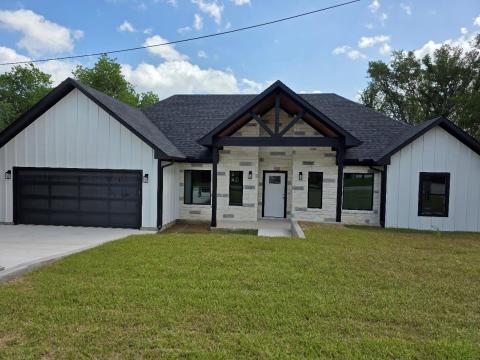 View of front of home featuring board and batten 
