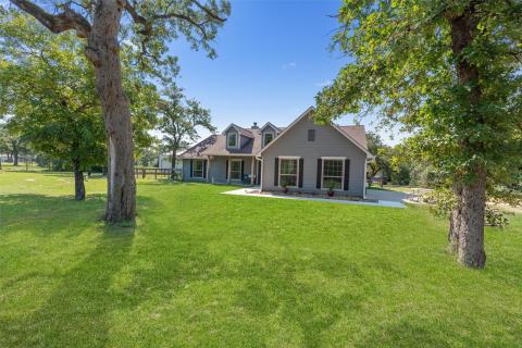 New england style home with a front yard