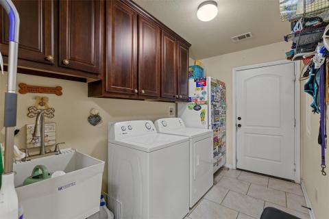 Laundry room with light tile patterned floors, ca