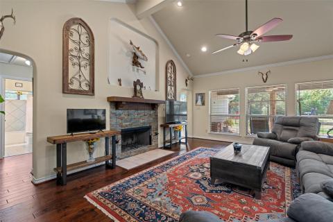 Living room featuring arched walkways, high vault