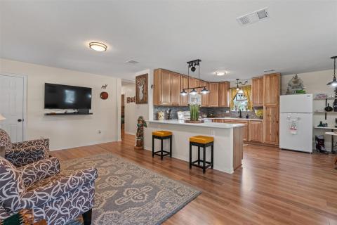 Kitchen with freestanding refrigerator, a breakfa