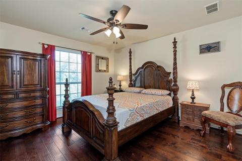 Bedroom featuring dark wood-type flooring and cei