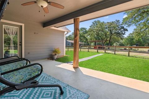 View of patio with a ceiling fan