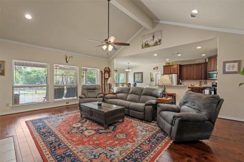 Living area with beamed ceiling, recessed lightin