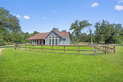 Back of property with a chimney