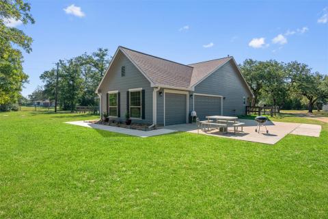 View of property exterior featuring a shingled ro