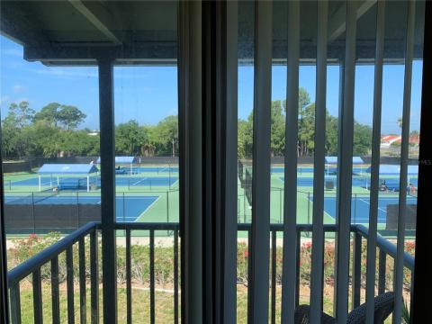 View out Juliet balcony to hard courts of Bradenton Tennis Center. The best tennis professionals in the world practice here.
