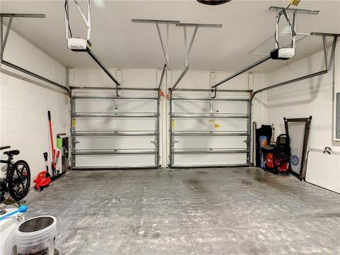 2-Car Garage with insulated steel raised panel garage doors with Genie garage door openers
