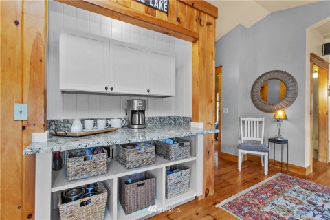 Coffee bar space or use your imagination. Hallway leads to main level bedroom and full bath. Coffee bar space or use your imagination. Hallway leads to main level bedroom and full bath.