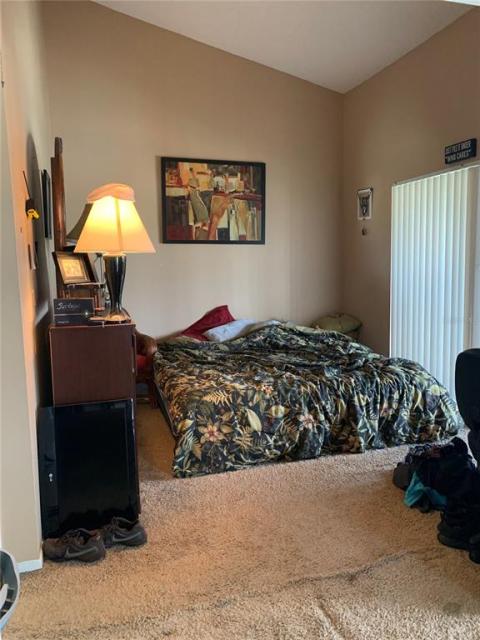 Cathedral bedroom showing lanai sliding door on right. Private bath is on left.