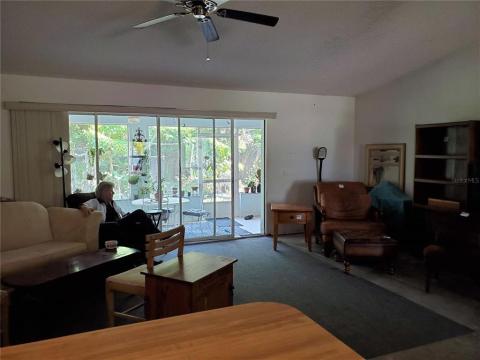 Livingroom looks out to the lush backyard