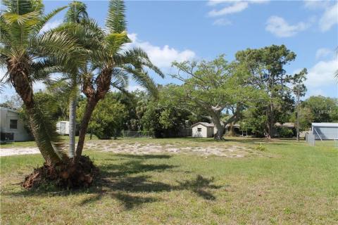 Northern property line runs to FPL Electric pole back right near fence.