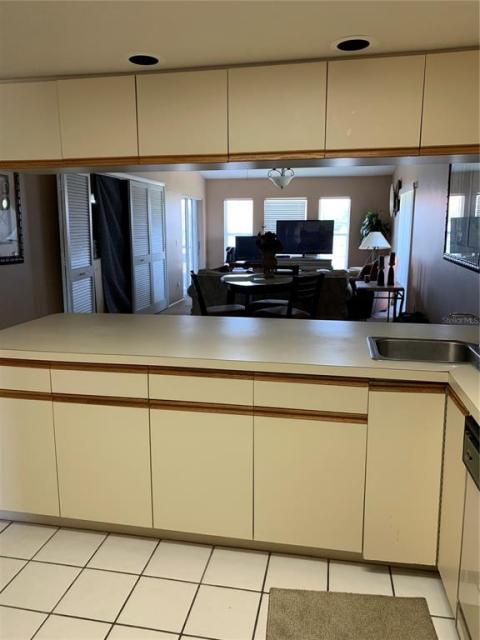 Kitchen. With furniture moved you can now see the partial bay views and tennis courts.